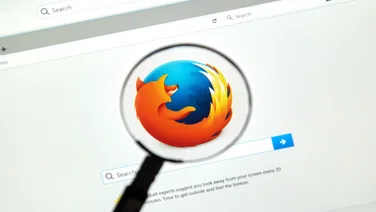 Mozilla firefox browser with logo inder magnifying glass