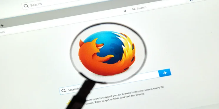 Mozilla firefox browser with logo inder magnifying glass