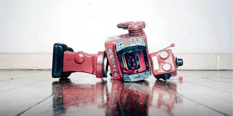 broken robot laying on its side