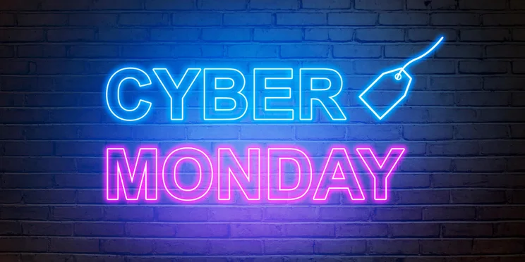Cyber Monday text from an electric lamp on the wall