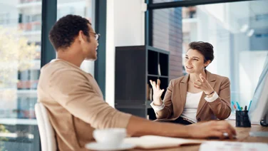 Female employee asking employee for a raise