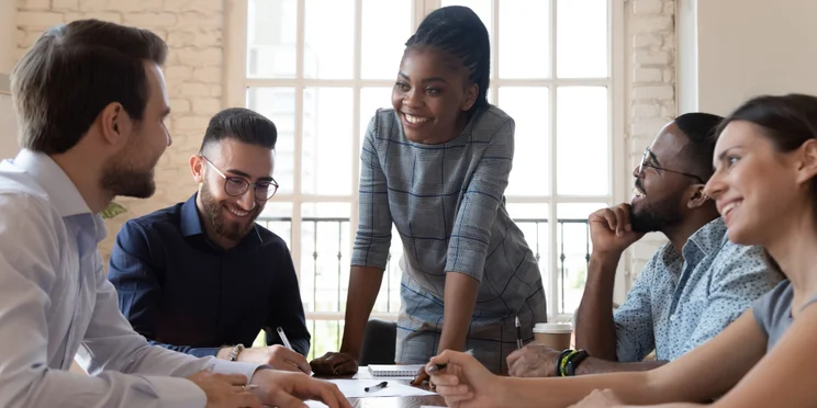 A leader in the office talking to their team