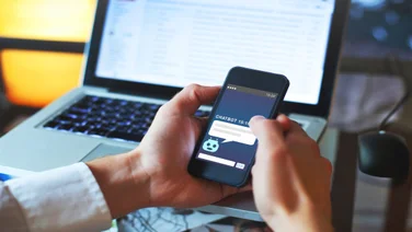 Person using AI chatbot at a desk