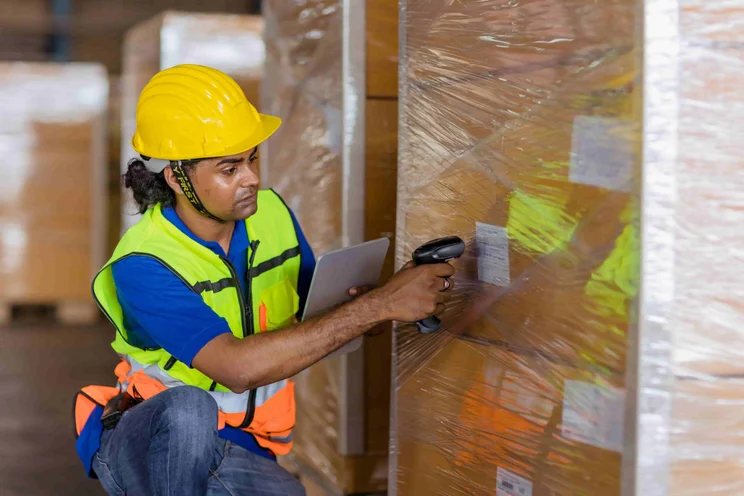 scanning a barcode label on an asset