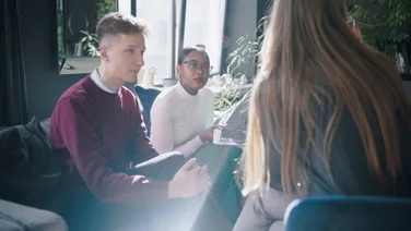 Two young people in a work discussion