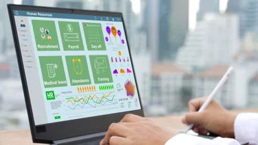 Generic HR software running on laptop