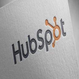 HubSpot logo on textured business card like paper