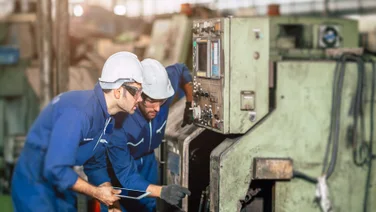Team of engineers conduct regular maintenance of company asset