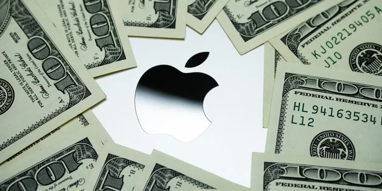 apple logo with money around it