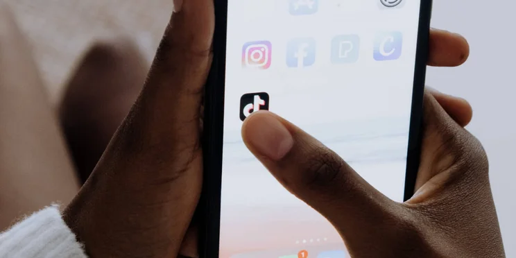 The TikTok logo icon on a phone