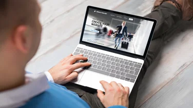 Man creating a website with a free website builder