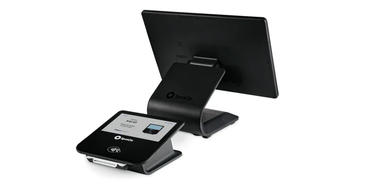 SpotOn 15-inch POS terminal with payment device and dual screen.