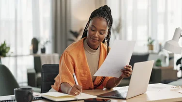 Remote worker writing a grant proposal