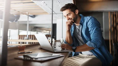 Man writing a grant application