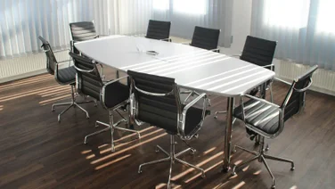 A workplace with an empty office table