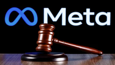 A judge's gavel with the meta logo in the background
