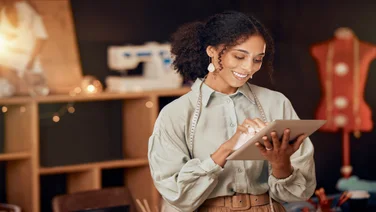 Female business owner using an iPad