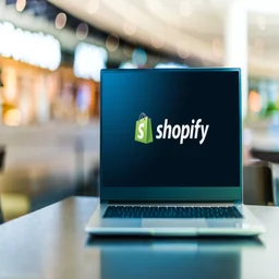 Shopify logo on laptop