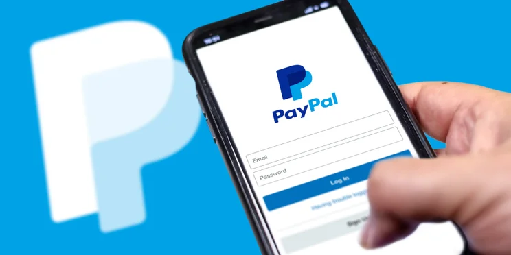 Paypal login information on a phone screen.