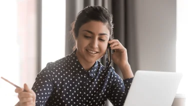 A woman takes a phone interview call.