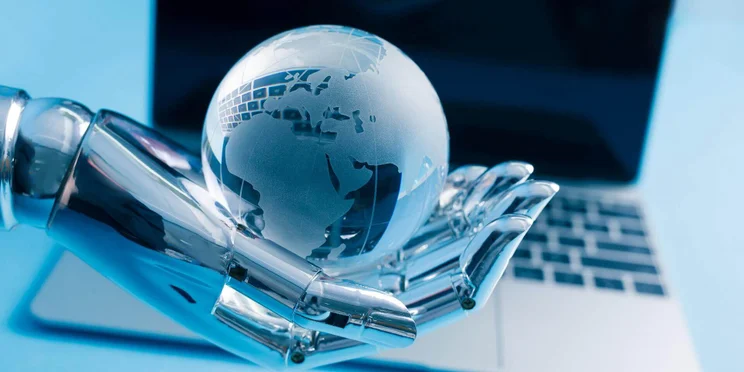 A robot hand holds a crystal ball