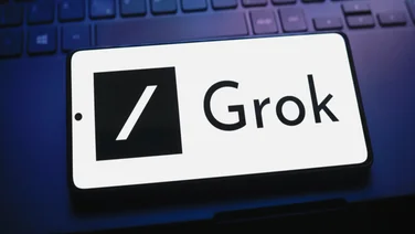 Grok logo on a phone screen.