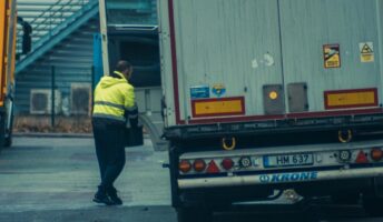 A trucker walks to a truck