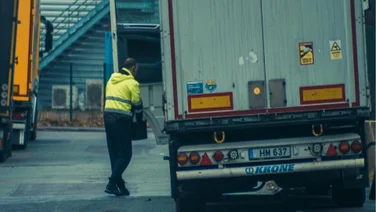 A trucker walks to a truck