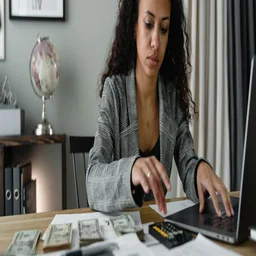 A woman does accounting with software