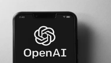 OpenAI logo on phone screen