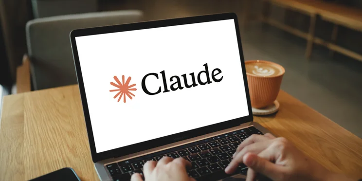 Claude AI on laptop with user typing