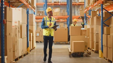 Men working in shipping warehouse