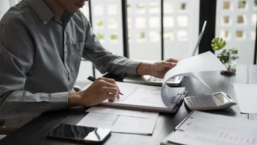 Person sitting at desk doing accounting