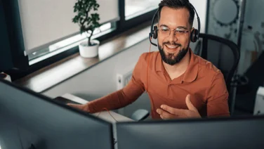 Person on headset working at desk