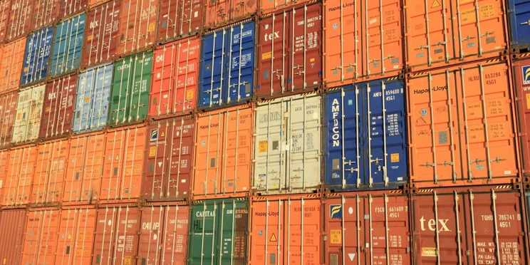 A wall of shipping containers