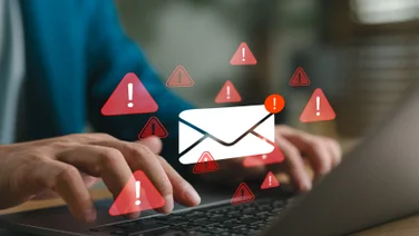 Person on laptop suffering data breach