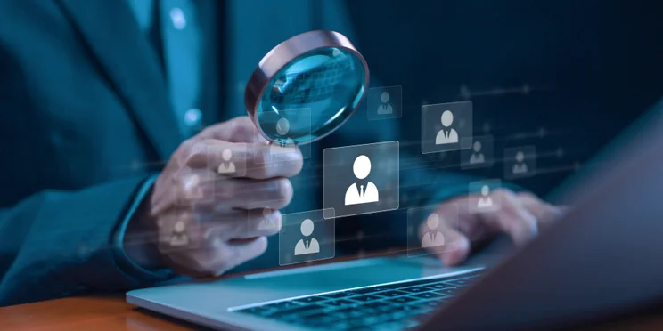 Man hiring with AI on laptop
