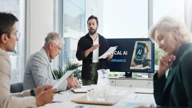 Employees in meeting discussing AI