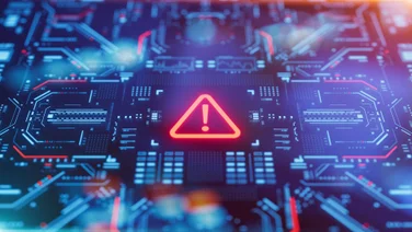 Computer chip with alert symbol on it