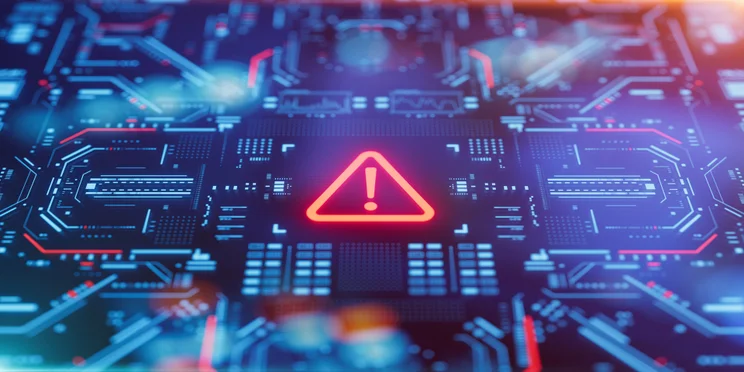 Computer chip with alert symbol on it