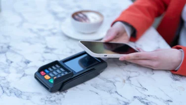 Person paying with phone