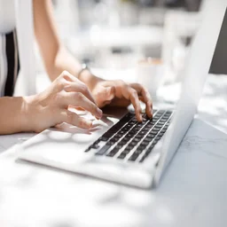Person typing on laptop