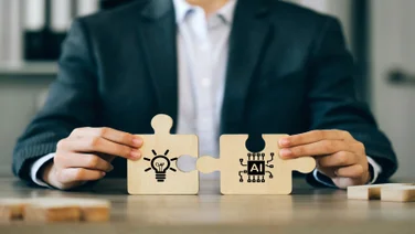 Jigsaw puzzle representing AI and human brain fitting together