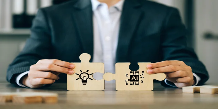 Jigsaw puzzle representing AI and human brain fitting together