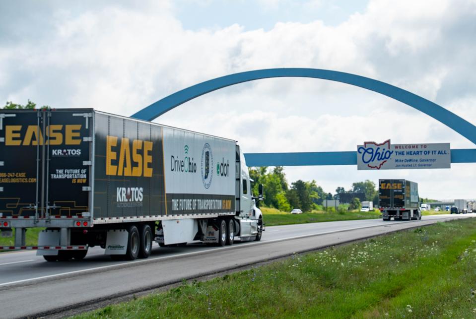 A pair of platooning automated trucks on the road