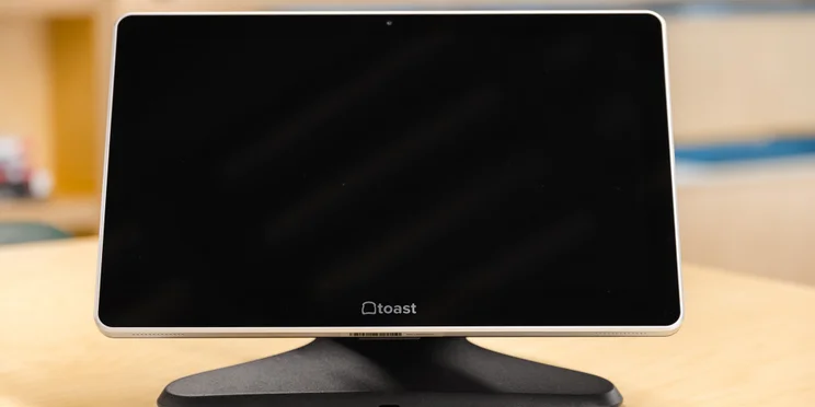 Toast POS Display device showing restaurant ordering interface.