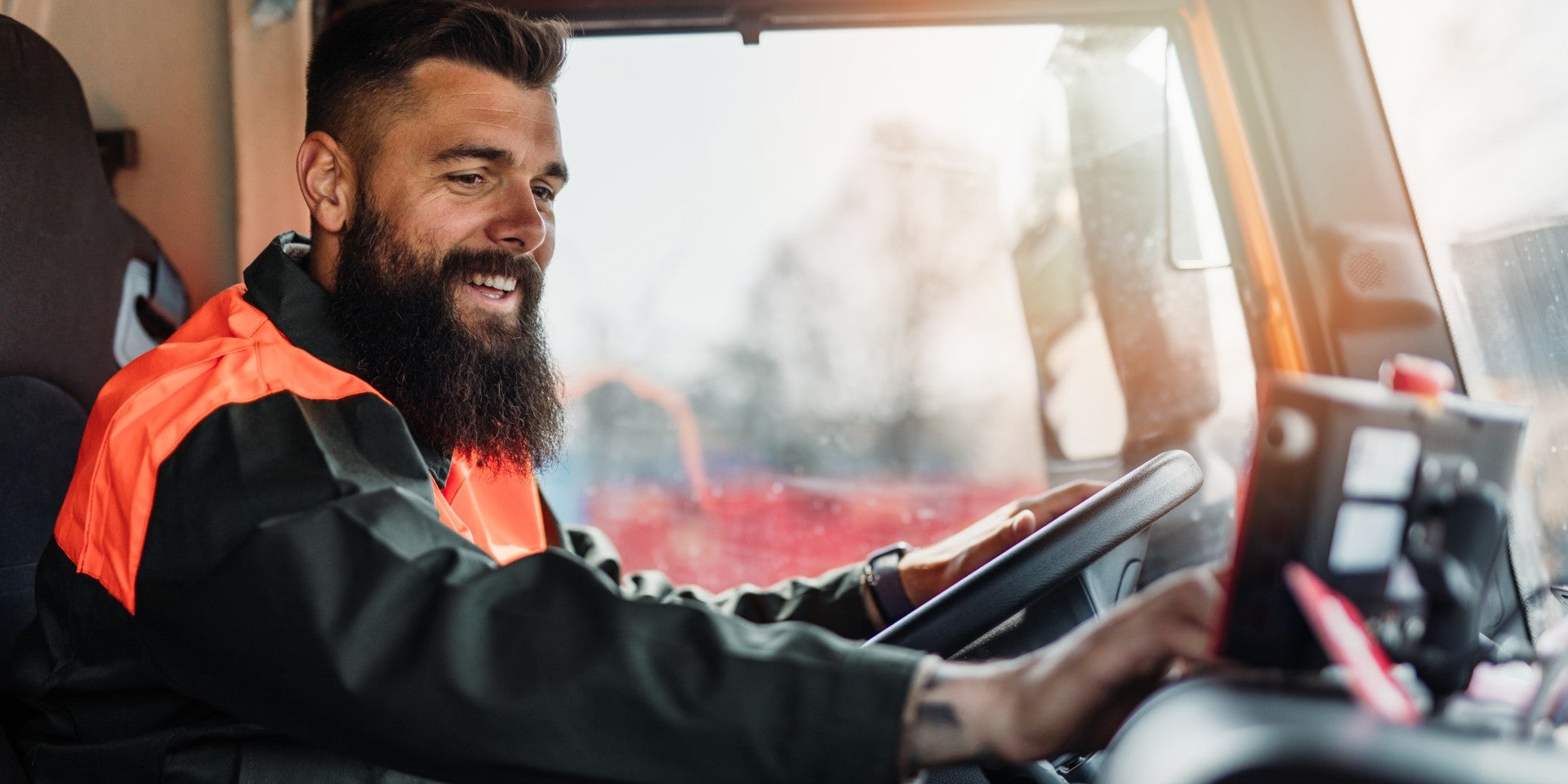 Man driving truck using software happy