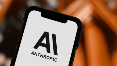 Anthropic logo on phone in black and white background