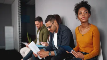 People waiting for job interview anxiously in room