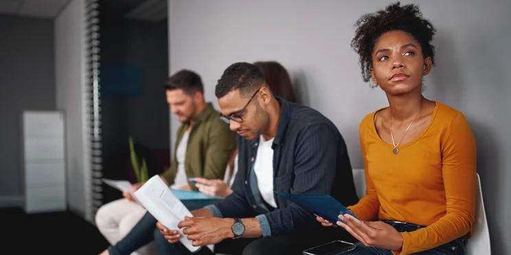 People waiting for job interview anxiously in room